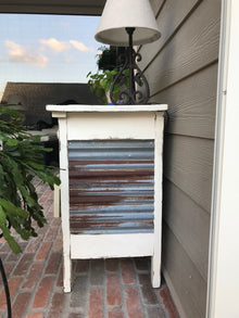 Custom corrugated metal panels installed on accent wall